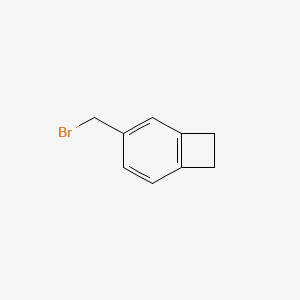 molecular formula C9H9Br B3255150 3-(Bromomethyl)bicyclo[4.2.0]octa-1,3,5-triene CAS No. 250337-98-5