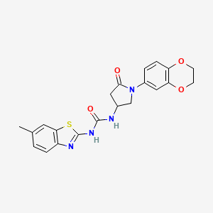 molecular formula C21H20N4O4S B3296853 3-[1-(2,3-Dihydro-1,4-benzodioxin-6-yl)-5-oxopyrrolidin-3-yl]-1-(6-methyl-1,3-benzothiazol-2-yl)urea CAS No. 894041-11-3