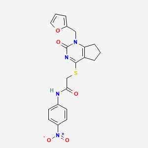 B3307296 2-((1-(furan-2-ylmethyl)-2-oxo-2,5,6,7-tetrahydro-1H-cyclopenta[d]pyrimidin-4-yl)thio)-N-(4-nitrophenyl)acetamide CAS No. 932962-32-8
