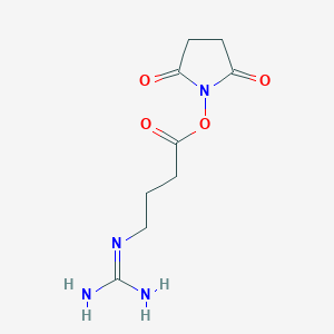 molecular formula C9H14N4O4 B3319323 N-succinimidyl 4-guanidinobutyrate CAS No. 1092706-01-8