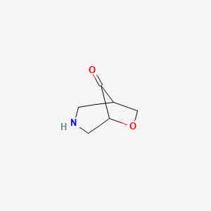 molecular formula C6H9NO2 B3322125 6-Oxa-3-azabicyclo[3.2.1]octan-8-one CAS No. 1419076-00-8