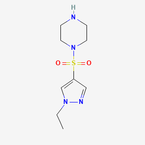 molecular formula C9H16N4O2S B3376062 1-((1-Ethyl-1H-pyrazol-4-yl)sulfonyl)piperazine CAS No. 1170622-94-2