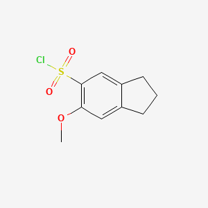 molecular formula C10H11ClO3S B3388564 6-Chlorosulfonyl-5-methoxyindane CAS No. 88040-92-0