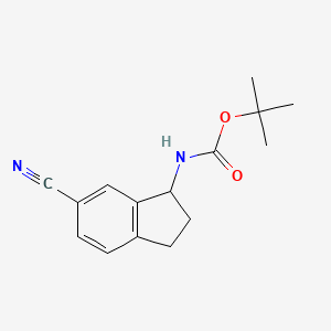 molecular formula C15H18N2O2 B3391545 tert-butyl N-(6-cyano-2,3-dihydro-1H-inden-1-yl)carbamate CAS No. 1823271-09-5