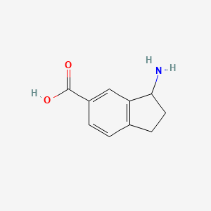 B3395008 (3R)-3-Aminoindane-5-carboxylic acid CAS No. 1213460-70-8