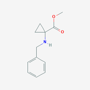 molecular formula C12H15NO2 B039249 Cyclopropanecarboxylic acid, 1-[(phenylmethyl)amino]-, methyl ester (9CI) CAS No. 119111-70-5