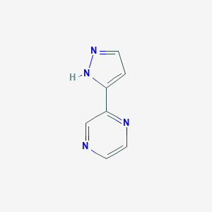 molecular formula C7H6N4 B039279 2-(1H-pyrazol-3-yl)pyrazine CAS No. 111781-54-5