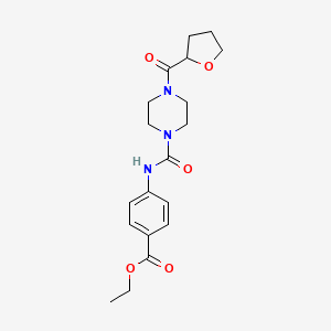 molecular formula C19H25N3O5 B4422672 Ethyl 4-({[4-(tetrahydrofuran-2-ylcarbonyl)piperazin-1-yl]carbonyl}amino)benzoate 
