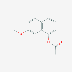 molecular formula C13H12O3 B045477 7-甲氧基萘基乙酸酯 CAS No. 150712-58-6