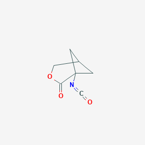 molecular formula C7H7NO3 B046994 1-Isocyanato-3-oxabicyclo[3.1.1]heptan-2-one CAS No. 116823-33-7