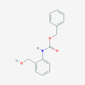 molecular formula C15H15NO3 B047119 Benzyl N-[2-(hydroxymethyl)phenyl]carbamate CAS No. 111881-64-2