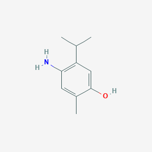 molecular formula C10H15NO B048690 2-Methyl-4-amino-5-(1-methylethyl)phenol CAS No. 117886-49-4