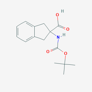 molecular formula C15H19NO4 B051017 2-((tert-Butoxycarbonyl)amino)-2,3-dihydro-1H-indene-2-carboxylic acid CAS No. 71066-00-7