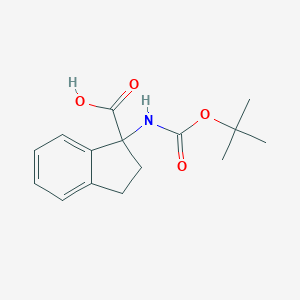 molecular formula C15H19NO4 B051280 1-((tert-Butoxycarbonyl)amino)-2,3-dihydro-1H-indene-1-carboxylic acid CAS No. 214139-26-1