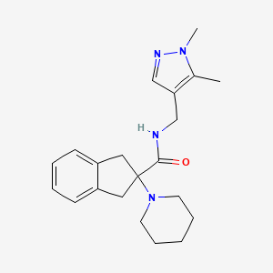molecular formula C21H28N4O B5269080 N-[(1,5-dimethyl-1H-pyrazol-4-yl)methyl]-2-(1-piperidinyl)-2-indanecarboxamide 