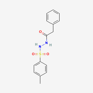 molecular formula C15H16N2O3S B5601185 N'-(4-methylphenyl)sulfonyl-2-phenylacetohydrazide 
