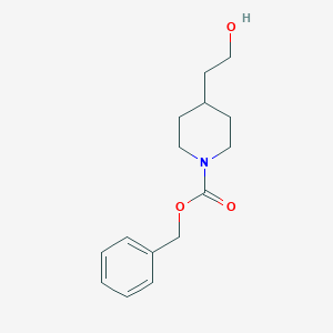 molecular formula C15H21NO3 B056055 Benzyl 4-(2-hydroxyethyl)piperidine-1-carboxylate CAS No. 115909-91-6