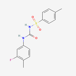molecular formula C15H15FN2O3S B5652967 N-{[(3-fluoro-4-methylphenyl)amino]carbonyl}-4-methylbenzenesulfonamide 