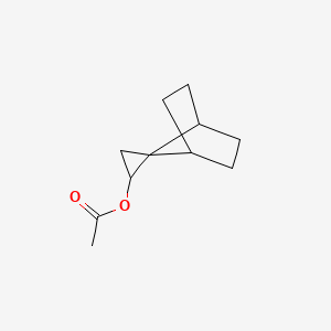 molecular formula C11H16O2 B566651 Spiro[bicyclo[2.2.1]heptane-7,2'-cyclopropane]-1'-yl acetate CAS No. 110030-33-6