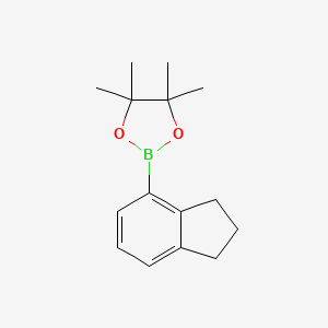molecular formula C15H21BO2 B571904 2-(2,3-dihydro-1H-inden-4-yl)-4,4,5,5-tetramethyl-1,3,2-dioxaborolane CAS No. 1252793-57-9