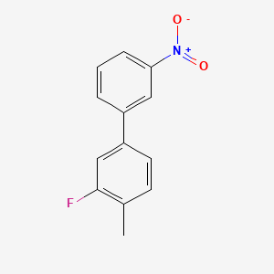 2-Fluoro-1-methyl-4-(3-nitrophenyl)benzene