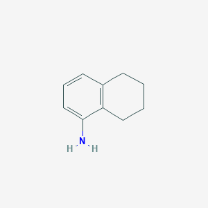 molecular formula C10H13N B057433 5,6,7,8-四氢-1-萘胺 CAS No. 2217-41-6