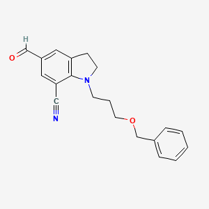 1-(3-(Benzyloxy)propyl)-5-formylindoline-7-carbonitrile