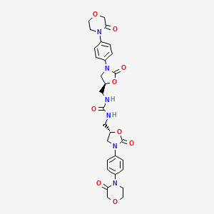 Urea, N,N'-bis[[(5S)-2-oxo-3-[4-(3-oxo-4-morpholinyl)phenyl]-5-oxazolidinyl]methyl]-