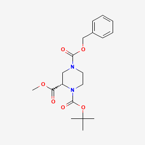 molecular formula C19H26N2O6 B582510 (S)-4-Benzyl 1-tert-butyl 2-methyl piperazine-1,2,4-tricarboxylate CAS No. 1211399-66-4