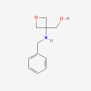 molecular formula C11H15NO2 B591619 (3-(Benzylamino)oxetan-3-yl)methanol CAS No. 1195684-52-6