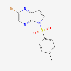 molecular formula C13H10BrN3O2S B598297 2-Bromo-5-tosyl-5H-pyrrolo[2,3-b]pyrazine CAS No. 1201186-54-0