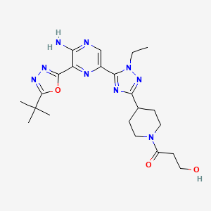 molecular formula C22H31N9O3 B605784 1-(4-(5-(5-Amino-6-(5-(tert-butyl)-1,3,4-oxadiazol-2-yl)pyrazin-2-yl)-1-ethyl-1H-1,2,4-triazol-3-yl)piperidin-1-yl)-3-hydroxypropan-1-one CAS No. 1620576-64-8