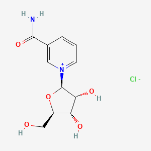 molecular formula C11H15ClN2O5 B609576 1-[(2R,3R,4S,5R)-3,4-dihydroxy-5-(hydroxymethyl)tetrahydrofuran-2-yl]pyridin-1-ium-3-carboxamide;chloride CAS No. 23111-00-4