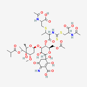molecular formula C43H62N4O23S3 B609828 3-[(2R,3R,4S,5R,6R)-5-[3-(2-acetamido-2-carboxyethyl)sulfanyl-2-[(2-acetamido-2-carboxyethyl)sulfanylcarbothioylamino]butanoyl]oxy-6-(acetyloxymethyl)-3-hydroxy-4-[(2R,4S,5S,6S)-5-hydroxy-4-methoxy-6-methyl-5-[1-(2-methylpropanoyloxy)ethyl]oxan-2-yl]oxyoxan-2-yl]-2,3-dihydroxy-6-imino-5-oxocyclohexene-1-carboxylic acid CAS No. 101411-71-6