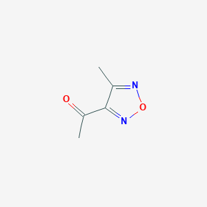 molecular formula C5H6N2O2 B061355 1-(4-Methyl-1,2,5-oxadiazol-3-yl)ethanone CAS No. 165067-10-7