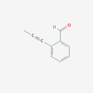 molecular formula C10H8O B061841 2-(丙-1-炔-1-基)苯甲醛 CAS No. 176910-65-9