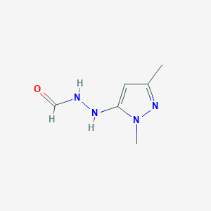 molecular formula C6H10N4O B061910 N-[(2,5-dimethylpyrazol-3-yl)amino]formamide CAS No. 170167-69-8