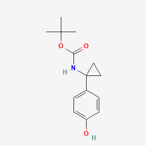 molecular formula C14H19NO3 B6307485 4-[1-(Boc-amino)cyclopropyl]phenol CAS No. 1394918-80-9
