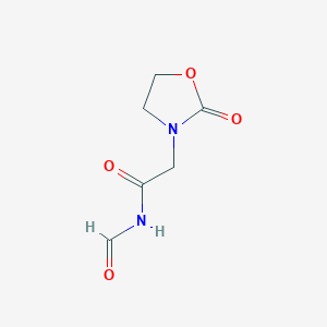 molecular formula C6H8N2O4 B064398 3-Oxazolidineacetamide, N-formyl-2-oxo- CAS No. 172514-90-8