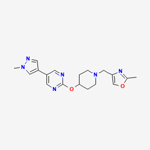 B6458911 2-({1-[(2-methyl-1,3-oxazol-4-yl)methyl]piperidin-4-yl}oxy)-5-(1-methyl-1H-pyrazol-4-yl)pyrimidine CAS No. 2549056-34-8