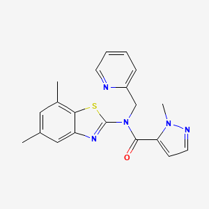 B6530274 N-(5,7-dimethyl-1,3-benzothiazol-2-yl)-1-methyl-N-[(pyridin-2-yl)methyl]-1H-pyrazole-5-carboxamide CAS No. 1019097-09-6