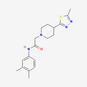 N-(3,4-dimethylphenyl)-2-[4-(5-methyl-1,3,4-thiadiazol-2-yl)piperidin-1-yl]acetamide