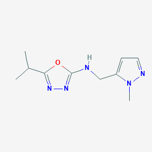 molecular formula C10H15N5O B6648923 N-[(2-methylpyrazol-3-yl)methyl]-5-propan-2-yl-1,3,4-oxadiazol-2-amine 