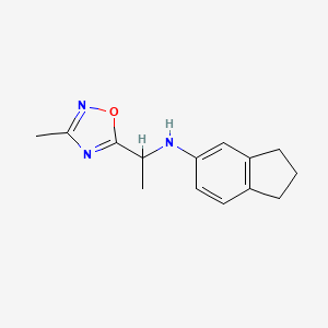 molecular formula C14H17N3O B6650150 N-[1-(3-methyl-1,2,4-oxadiazol-5-yl)ethyl]-2,3-dihydro-1H-inden-5-amine 