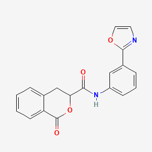 molecular formula C19H14N2O4 B6694639 N-[3-(1,3-oxazol-2-yl)phenyl]-1-oxo-3,4-dihydroisochromene-3-carboxamide 