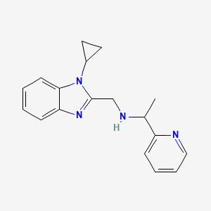 molecular formula C18H20N4 B6702352 N-[(1-cyclopropylbenzimidazol-2-yl)methyl]-1-pyridin-2-ylethanamine 