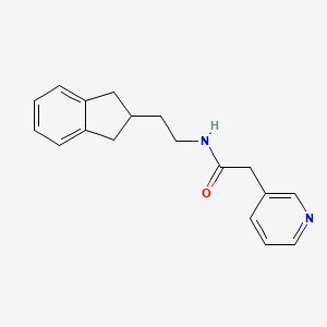 molecular formula C18H20N2O B6722587 N-[2-(2,3-dihydro-1H-inden-2-yl)ethyl]-2-pyridin-3-ylacetamide 