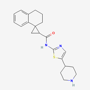 molecular formula C21H25N3OS B6725533 N-(5-piperidin-4-yl-1,3-thiazol-2-yl)spiro[2,3-dihydro-1H-naphthalene-4,2'-cyclopropane]-1'-carboxamide 