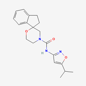 molecular formula C19H23N3O3 B6759675 N-(5-propan-2-yl-1,2-oxazol-3-yl)spiro[1,2-dihydroindene-3,2'-morpholine]-4'-carboxamide 