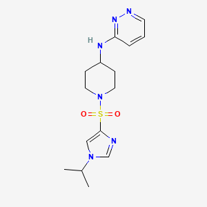 molecular formula C15H22N6O2S B6759808 N-[1-(1-propan-2-ylimidazol-4-yl)sulfonylpiperidin-4-yl]pyridazin-3-amine 